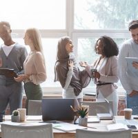 Advantages of Partnering with an MBE Temporary Staffing Agency for Diversity Initiatives 19 People discussing ideas in an office